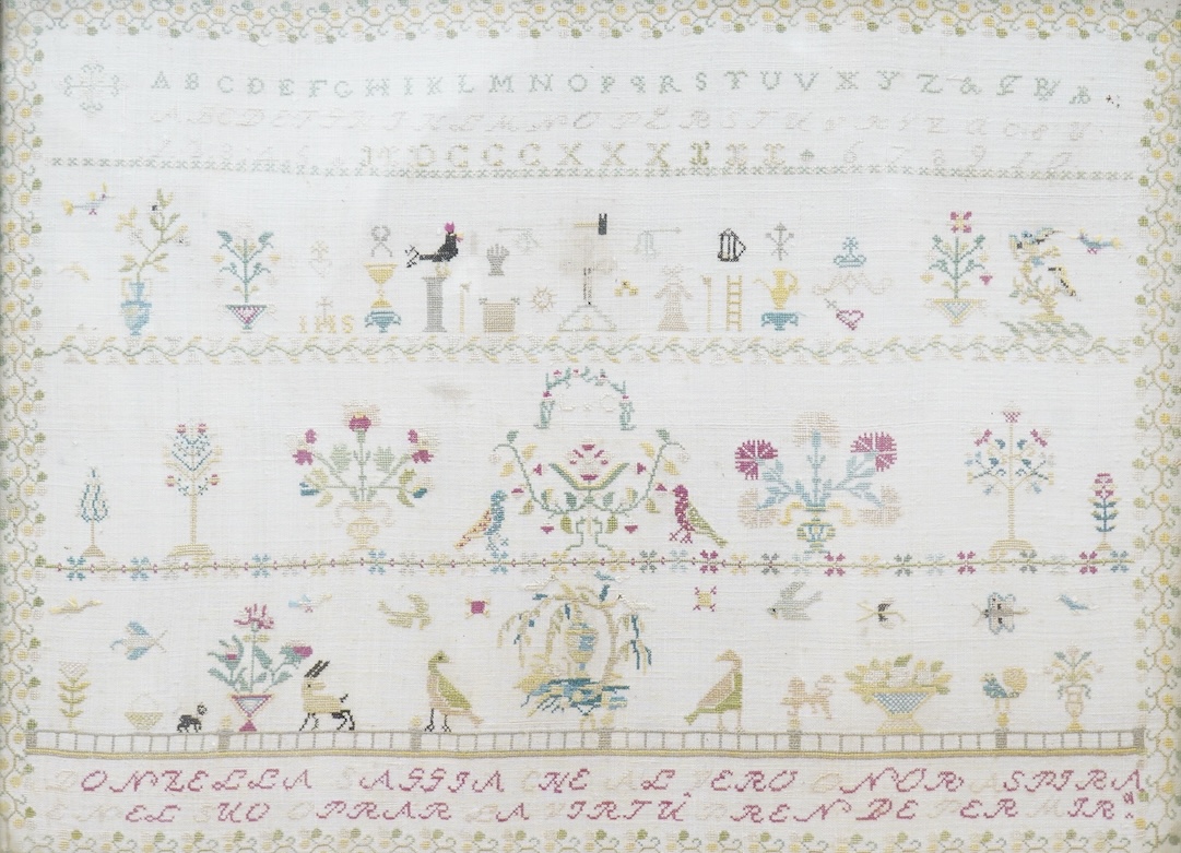 An unusual Ligurian Italian finely embroidered 19th century sampler. Worked with a verse below of row of the alphabet and three rows of motifs of birds flowers and animals. The verse written in the Ligurian regional dial